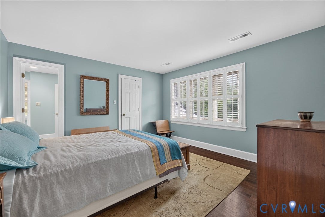 1108 Shallow Well Road, Manakin Sabot, VA 23103 Hardwood flooring, crisp white trim, and a window with plantation shutters