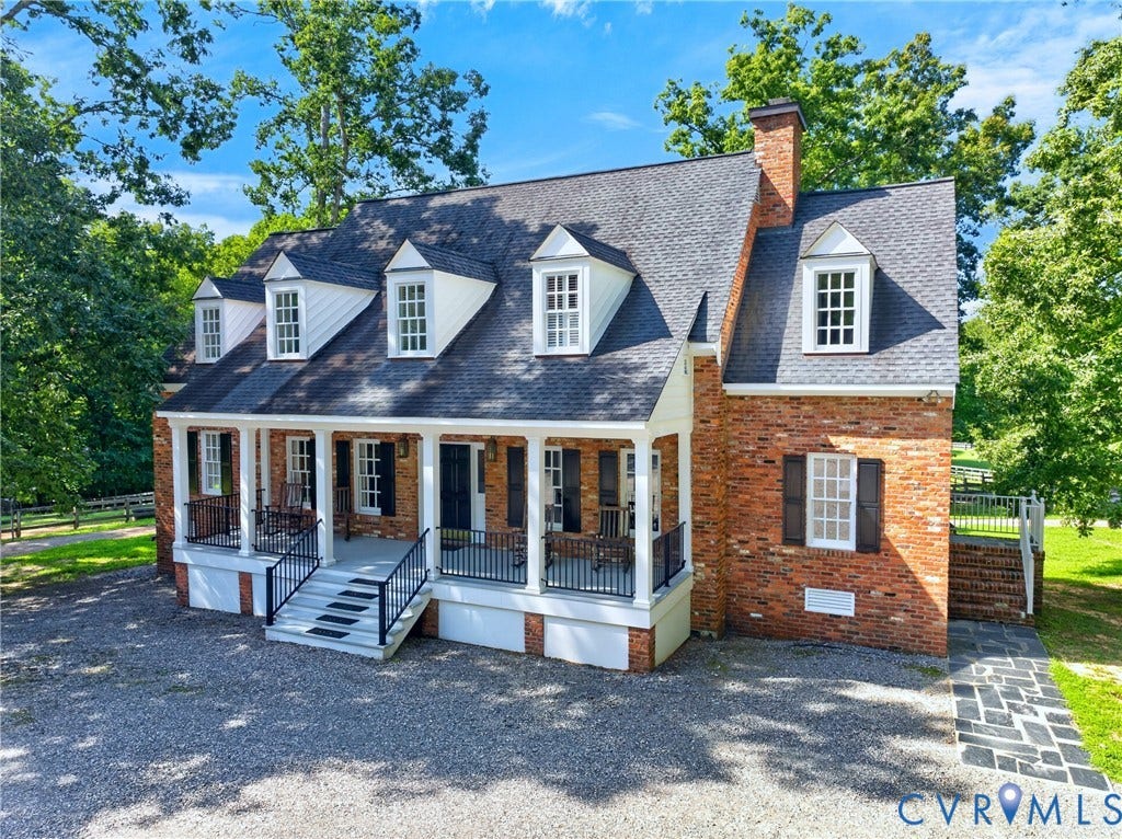 1108 Shallow Well Road, Manakin Sabot, VA 23103 Brick exterior featuring a covered front porch, dormer windows, and a chimney