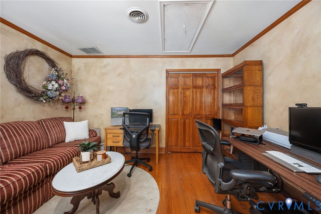 Hardwood flooring, painted walls, crown molding, double bi-fold closet doors, and recessed lighting