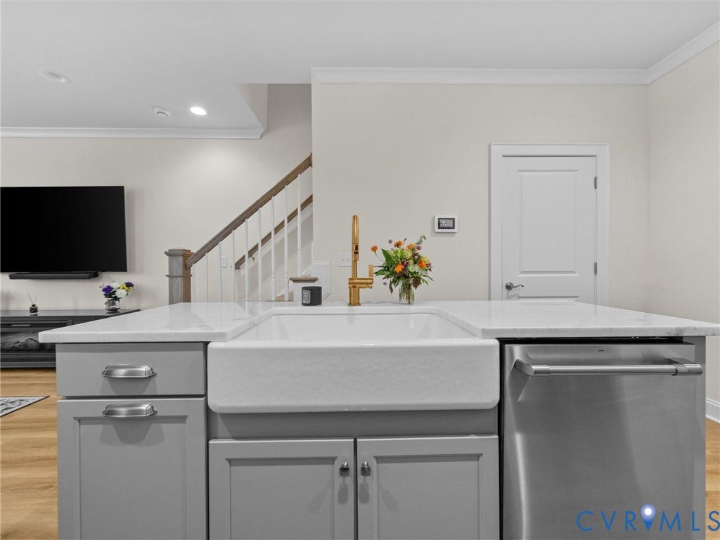 366 Souldren Walk, #A, Short Pump, Henrico, VA 23233 Kitchen island with gray cabinetry, white farmhouse sink, white countertop, and stainless steel dishwasher