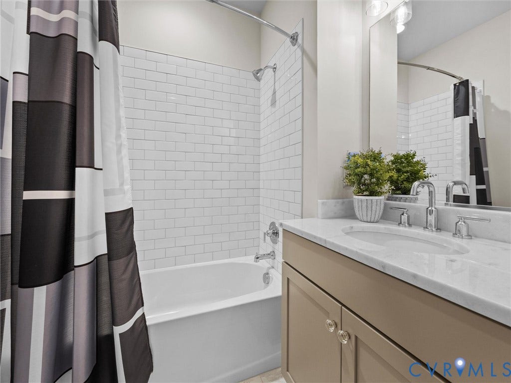 366 Souldren Walk, #A, Short Pump, Henrico, VA 23233 White subway tile shower surround with chrome fixtures, a built-in bathtub, and a single vanity featuring a stone countertop
