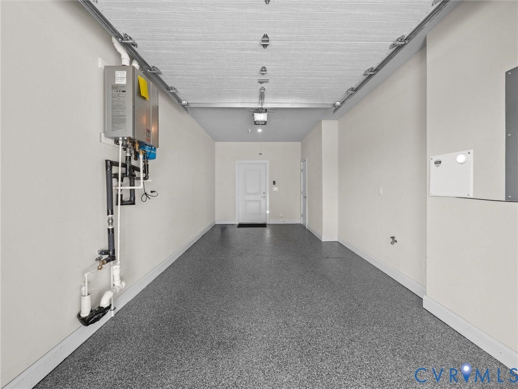 366 Souldren Walk, #A, Short Pump, Henrico, VA 23233 Epoxy-coated flooring, white interior walls, overhead lighting, and a tankless water heater installation