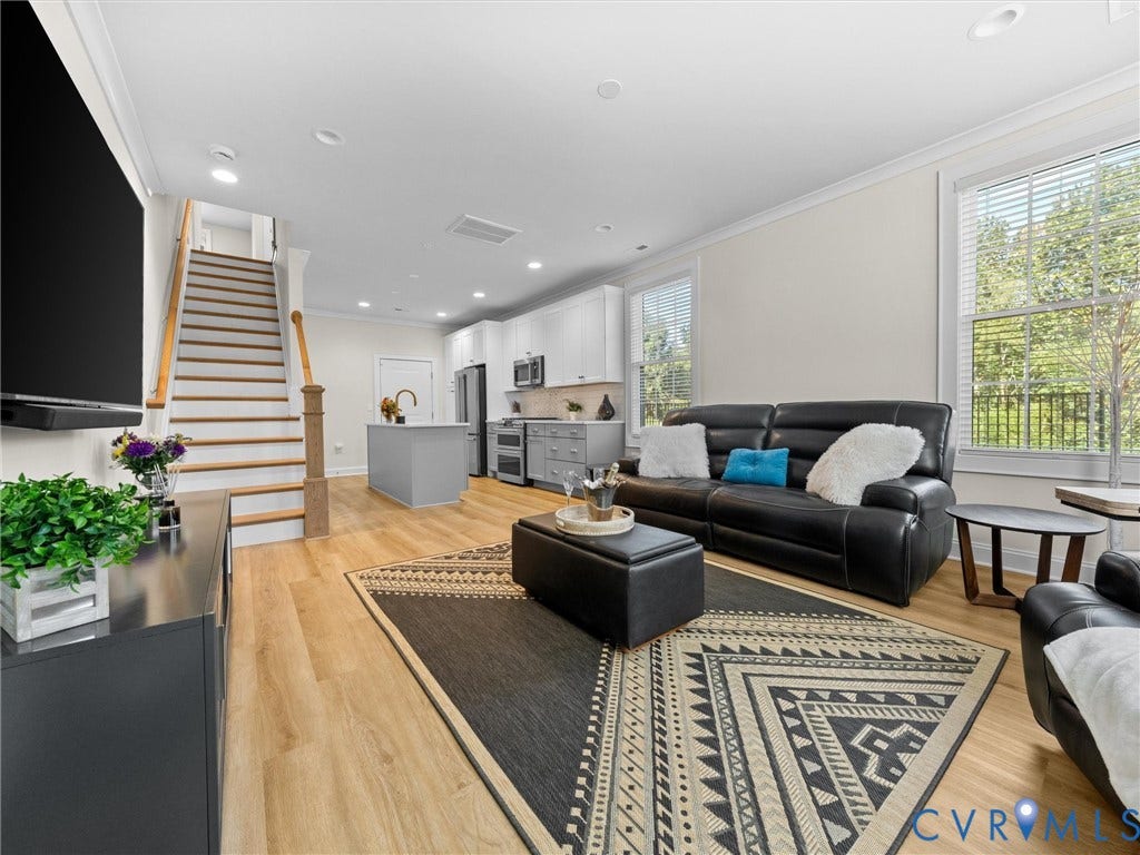 366 Souldren Walk, #A, Short Pump, Henrico, VA 23233 Open-concept living area with wood-finish flooring, white walls, recessed lighting, and large windows
