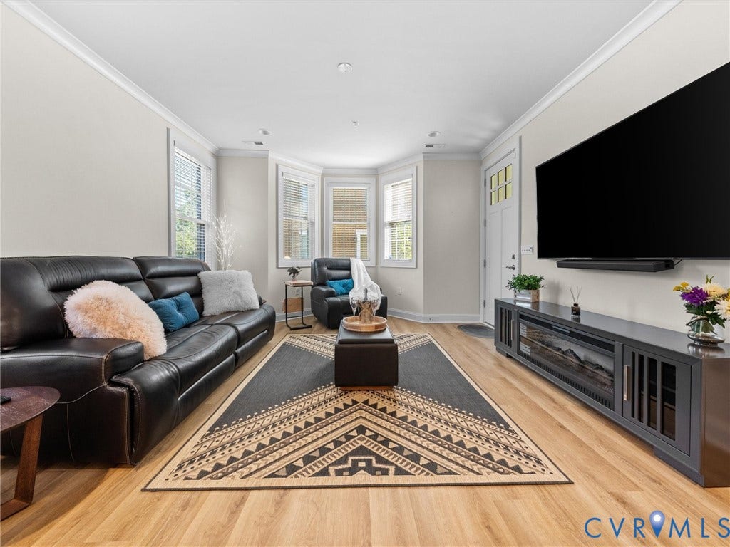 366 Souldren Walk, #A, Short Pump, Henrico, VA 23233 Wood-finish flooring throughout, white crown molding, bay window with blinds, recessed lighting, and a front entry door with glass panels