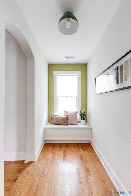 4015 Mount Vernon Street, Bellevue, Richmond, VA 23227 Hardwood flooring, arched doorway, built-in window seat, recessed window, and a contemporary ceiling light fixture