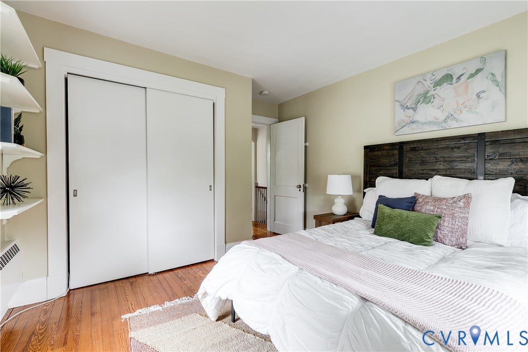 4015 Mount Vernon Street, Bellevue, Richmond, VA 23227 Hardwood flooring, painted walls, white trim, sliding closet doors, and built-in shelving