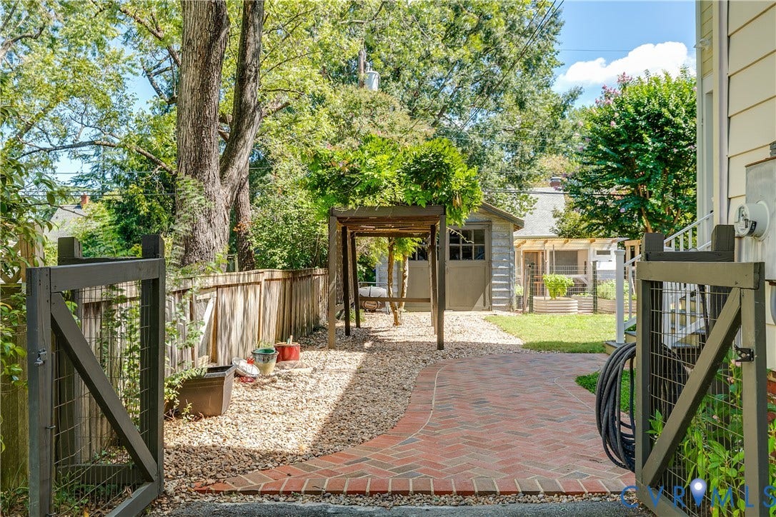 4015 Mount Vernon Street, Bellevue, Richmond, VA 23227 Brick pathway leading to a gravel patio with an arbor