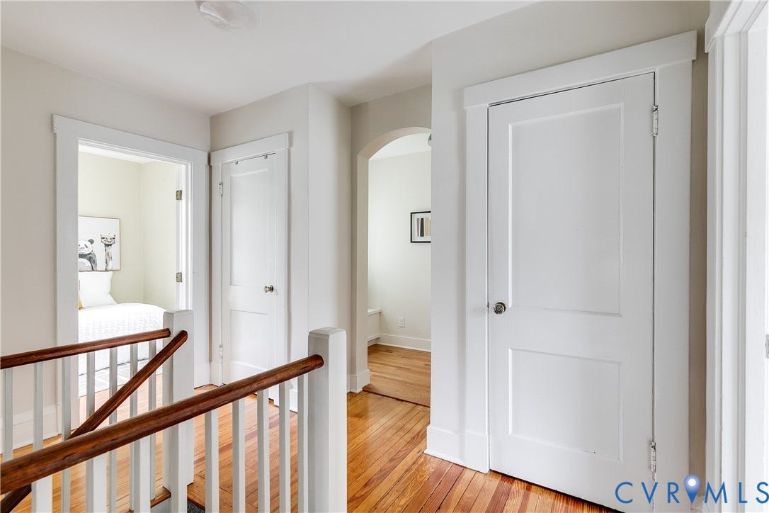 4015 Mount Vernon Street, Bellevue, Richmond, VA 23227 Hardwood flooring throughout, white painted trim, white paneled doors, and an arched doorway