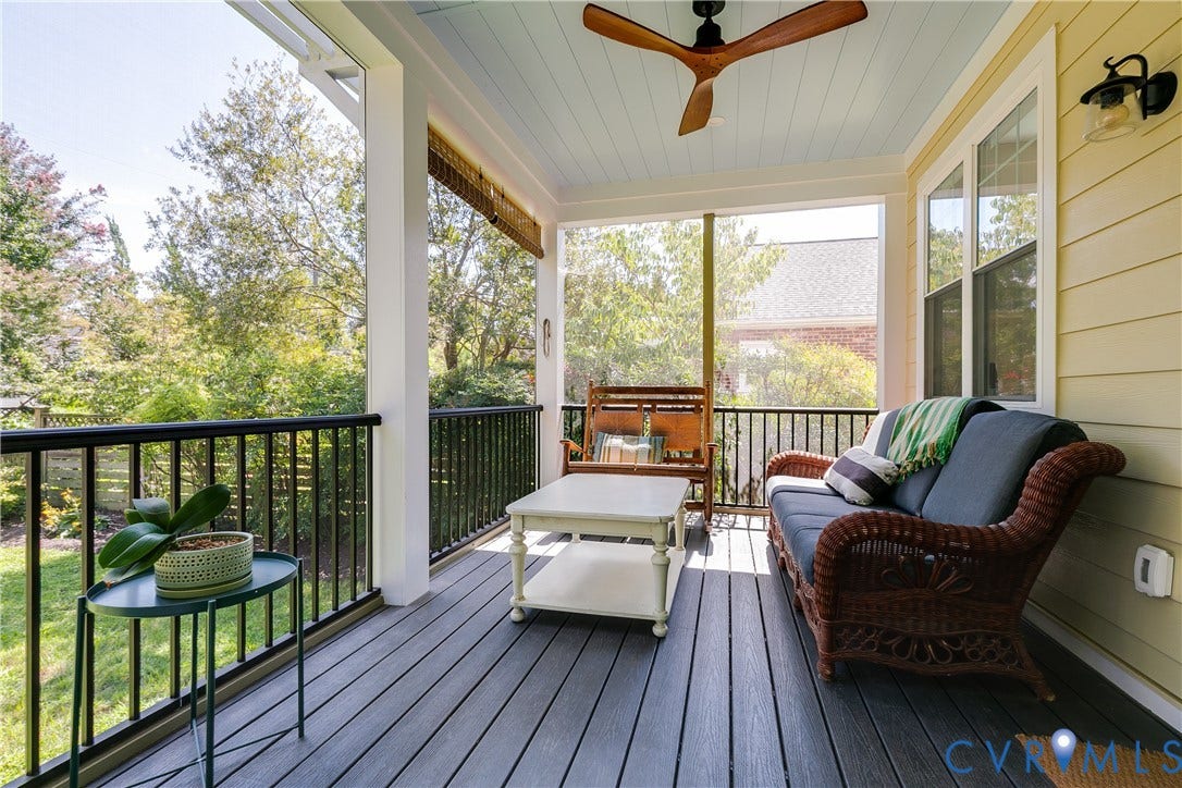 4015 Mount Vernon Street, Bellevue, Richmond, VA 23227 Screened porch with composite decking, white architectural columns, a light blue beadboard ceiling, and a ceiling fan