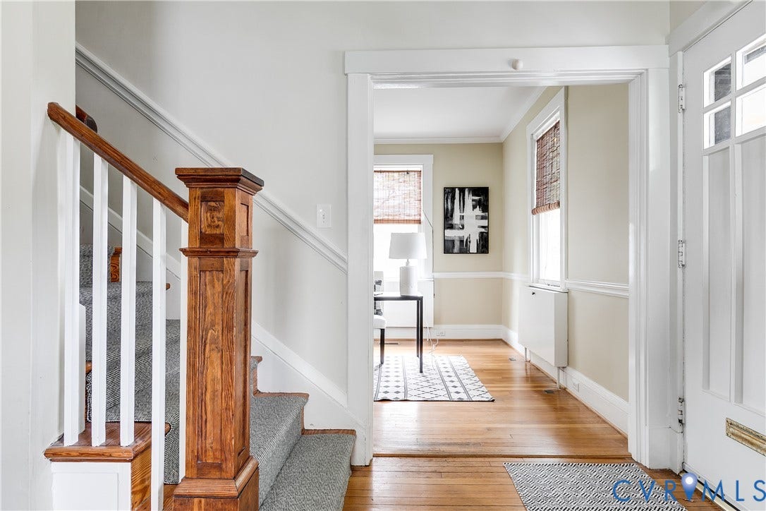 4015 Mount Vernon Street, Bellevue, Richmond, VA 23227 Hardwood flooring, painted trim, paneled interior door, wood newel post, and carpeted staircase