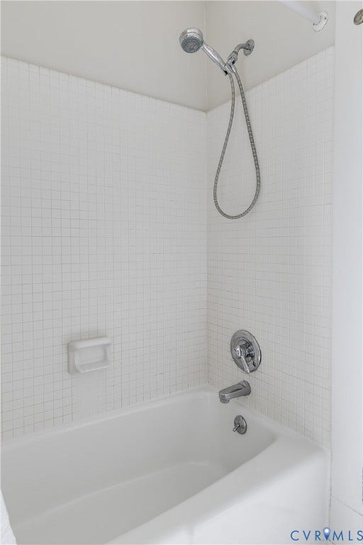 4015 Mount Vernon Street, Bellevue, Richmond, VA 23227 Bathtub and shower combination with white tile surround, chrome fixtures, and a hand-held showerhead