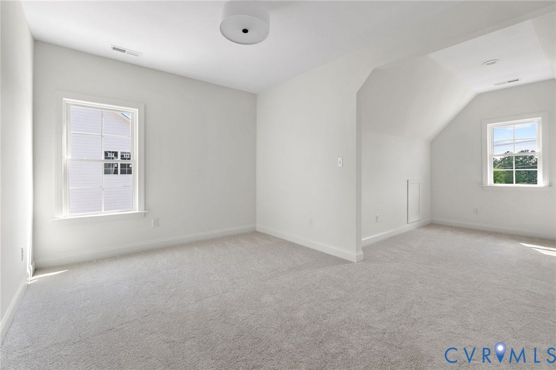 2871 Old Pump Road, The Preserve At John Rolfe, Henrico, VA 23233 Carpeted flooring, white walls, two windows, and a flush mount ceiling light fixture