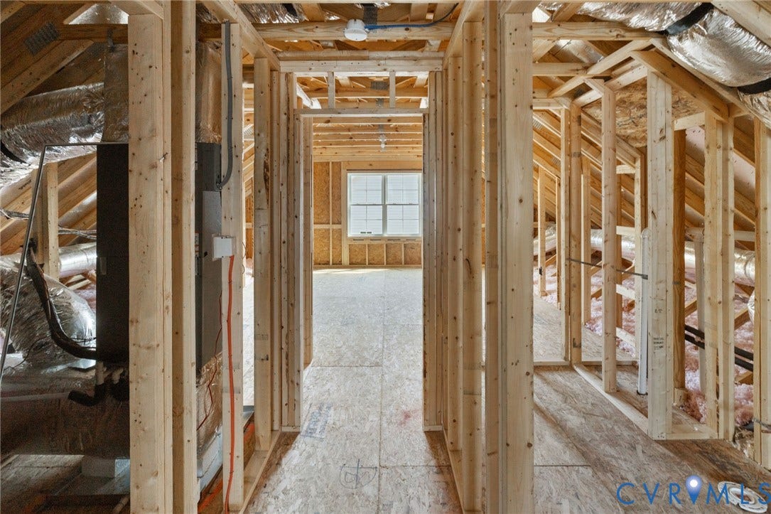 2871 Old Pump Road, The Preserve At John Rolfe, Henrico, VA 23233 New construction framing with exposed wooden beams, subflooring, and a single window
