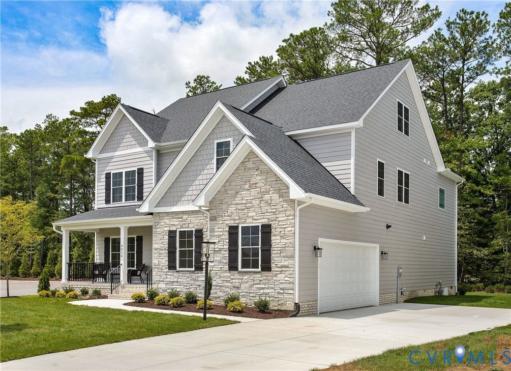 2871 Old Pump Road, The Preserve At John Rolfe, Henrico, VA 23233 Two-story exterior with stone and siding accents, prominent front porch with white columns, attached garage, and a concrete driveway