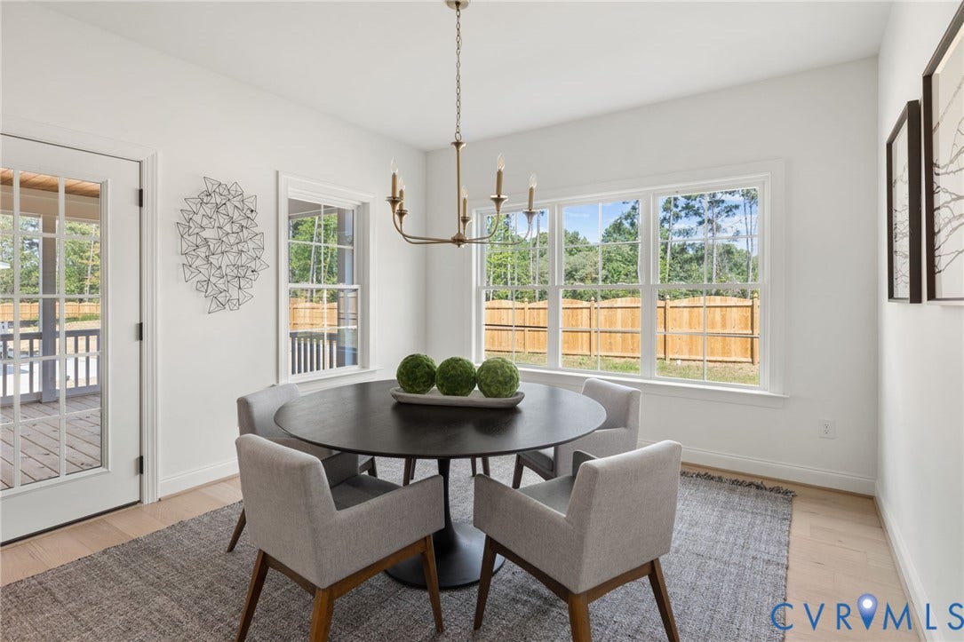 2871 Old Pump Road, The Preserve At John Rolfe, Henrico, VA 23233 Multiple large windows, French doors, light wood-finish flooring, and a candelabra chandelier