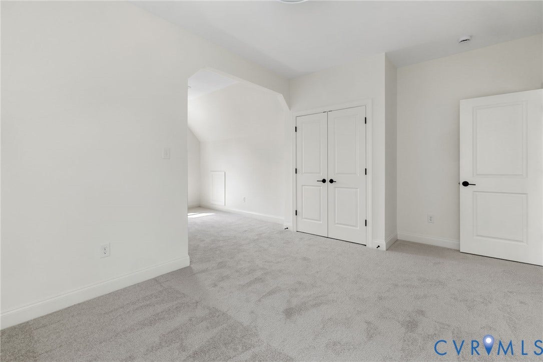 2871 Old Pump Road, The Preserve At John Rolfe, Henrico, VA 23233 Expansive room with neutral carpeting and a fresh white color palette