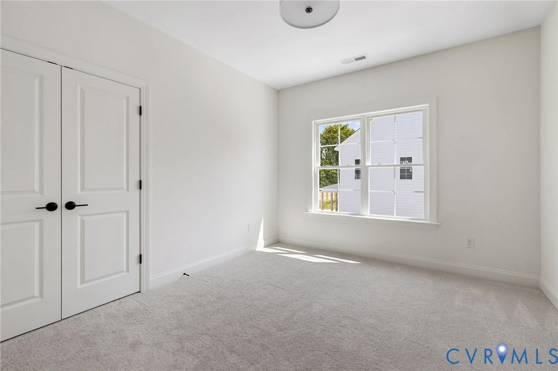 2871 Old Pump Road, The Preserve At John Rolfe, Henrico, VA 23233 White walls with a window, light gray carpet, and white double doors with matte black hardware