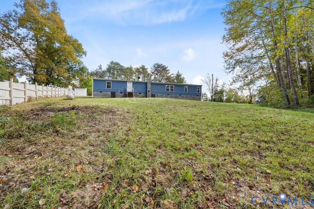 274 Frenchs Store Road, Cumberland, VA 23040 Expansive lot featuring a blue-sided exterior, stone chimney, and perimeter fencing