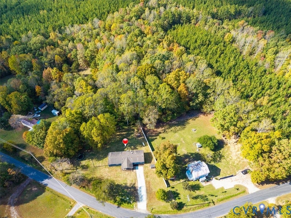 274 Frenchs Store Road, Cumberland, VA 23040 Aerial perspective featuring expansive acreage, mature perimeter woodland, paved driveway, and open grass areas