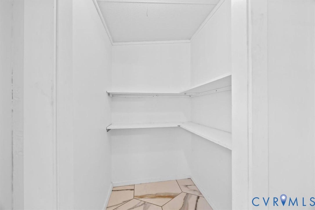 274 Frenchs Store Road, Cumberland, VA 23040 Storage area featuring multi-level white shelving and neutral-toned tile flooring
