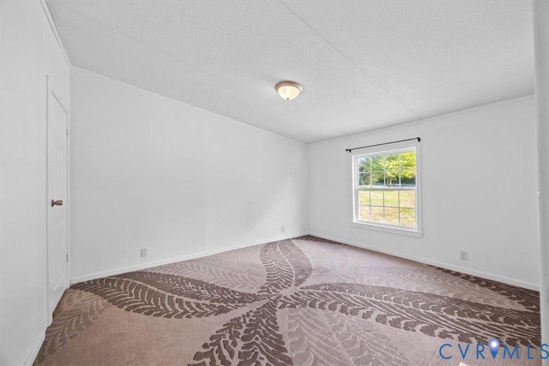 274 Frenchs Store Road, Cumberland, VA 23040 Interior room featuring pattern-textured carpeting, a single-hung window, and a flush-mount ceiling light fixture