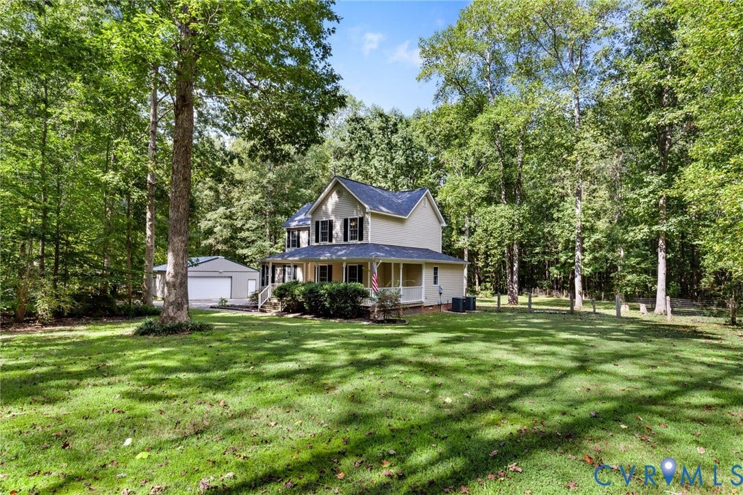 4350 Steger Creek Drive, Powhatan, VA 23139 Two-story residence with a covered front porch, a detached garage, and a spacious lawn surrounded by mature trees