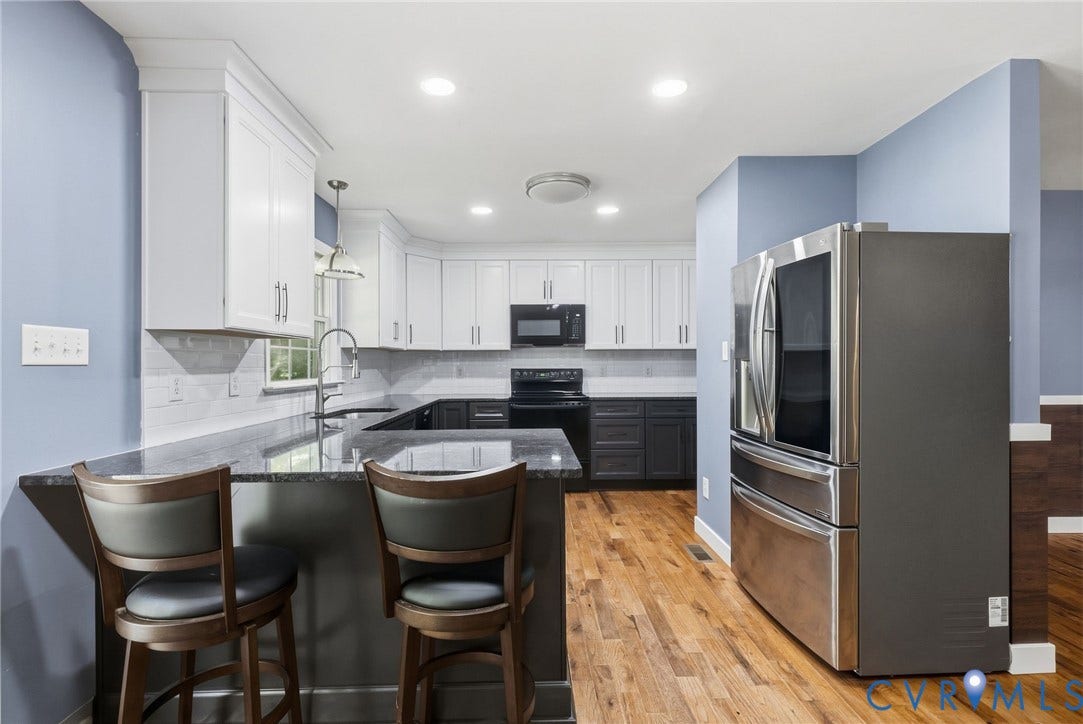 4350 Steger Creek Drive, Powhatan, VA 23139 Kitchen featuring wood-finish flooring, two-tone cabinetry, a dark countertop, a stainless steel refrigerator, and recessed lighting