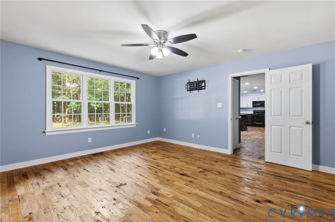 4350 Steger Creek Drive, Powhatan, VA 23139 Wood-finish flooring, overhead ceiling fan with lighting, multiple pane windows, and a panel door