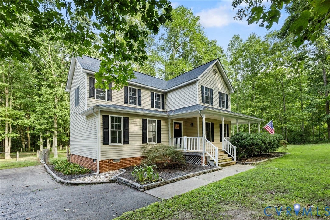 4350 Steger Creek Drive, Powhatan, VA 23139 Two-story residence with light-colored siding and a dark-shingled roof