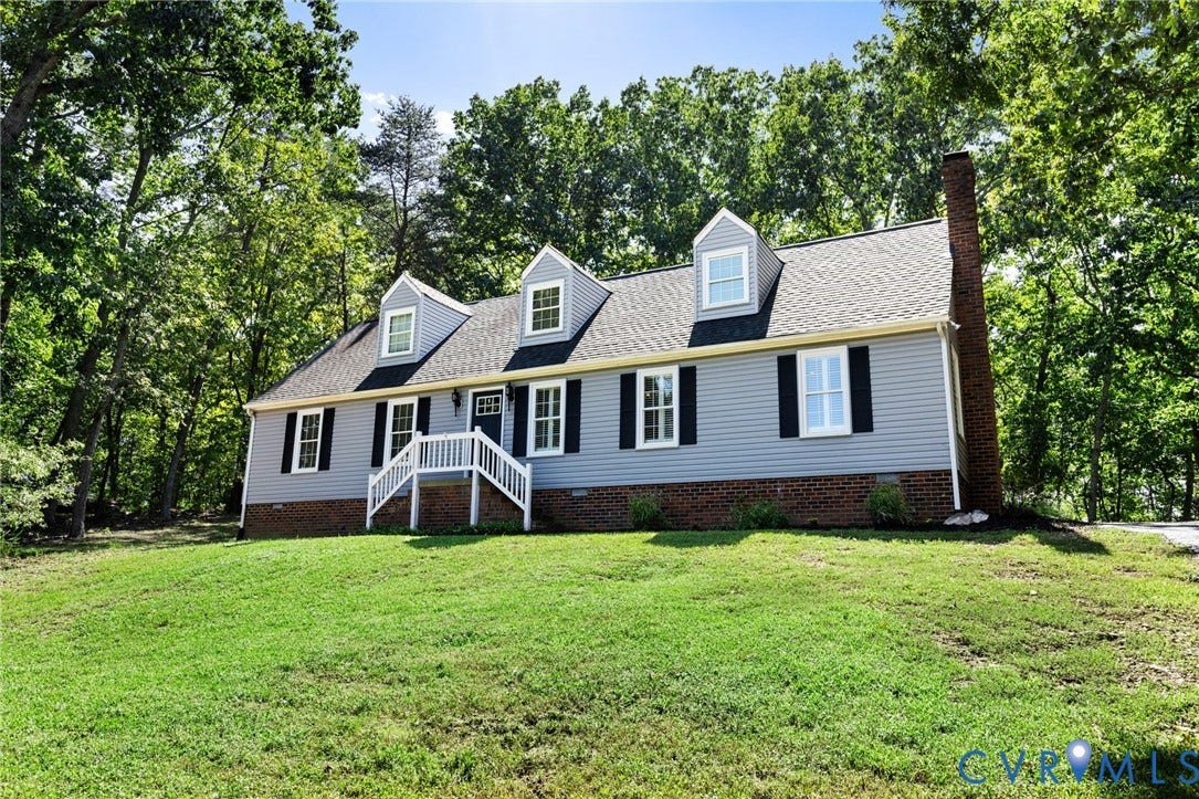 2137 Scarlet Mill Lane, Powhatan, VA 23139 Light blue siding exterior with a brick foundation and three dormer windows