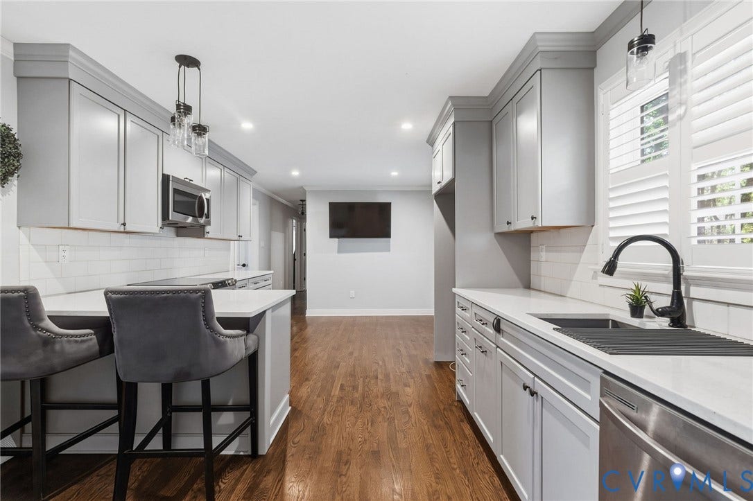 2137 Scarlet Mill Lane, Powhatan, VA 23139 Kitchen featuring gray shaker-style cabinetry, white subway tile backsplash, white countertops, stainless steel appliances, and wood-finish flooring