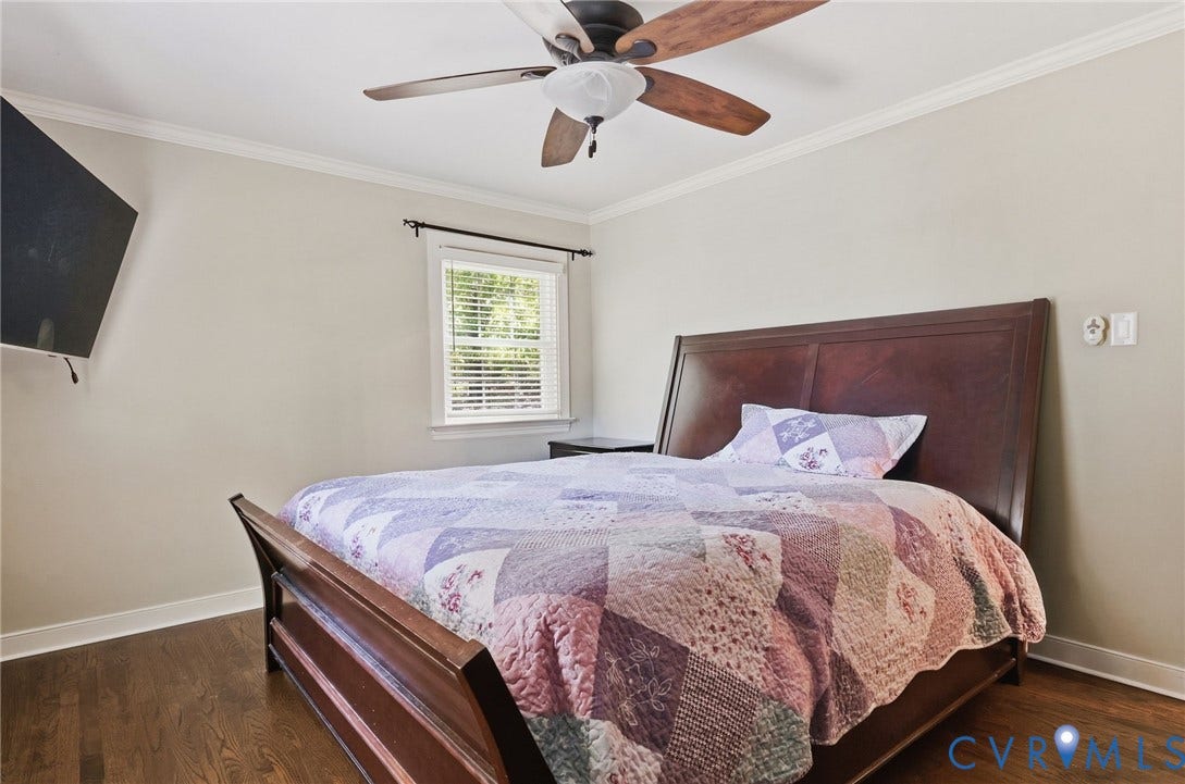 2137 Scarlet Mill Lane, Powhatan, VA 23139 Wood-finish flooring, crown molding, and a ceiling fan with light fixture