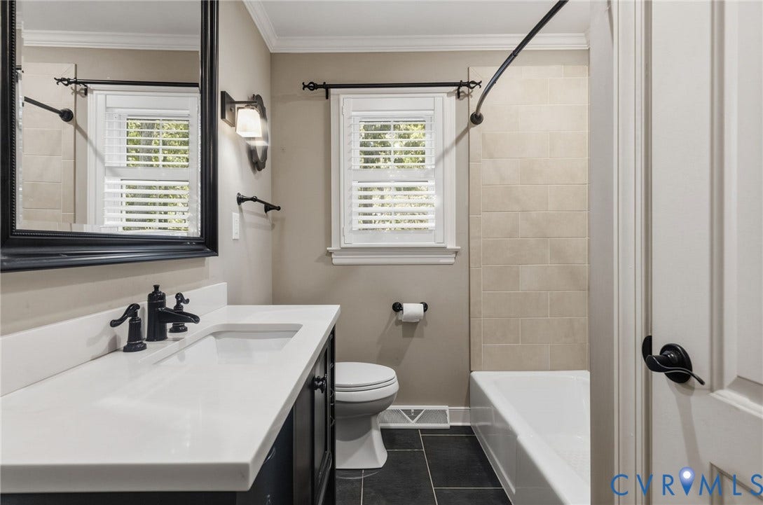 2137 Scarlet Mill Lane, Powhatan, VA 23139 Bathroom featuring a vanity with a white countertop, dark cabinetry, and a rectangular undermount sink