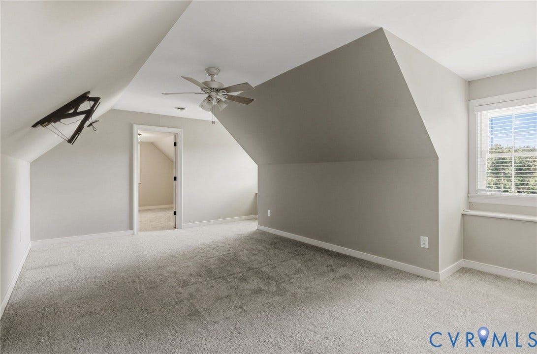 2137 Scarlet Mill Lane, Powhatan, VA 23139 Carpeted room with sloped ceilings, a ceiling fan with integrated lighting, a window with blinds, and a white trim door