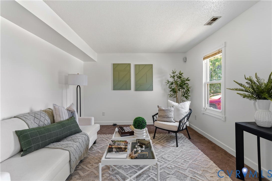 952 Pleasant Street, Henrico, VA 23223 Recessed ceiling beams, white walls, and a window with wood trim