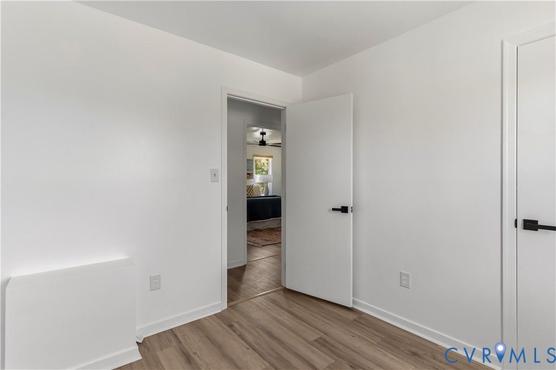 952 Pleasant Street, Henrico, VA 23223 Wood-finish flooring, white interior doors with matte black hardware, and light-colored wall paint