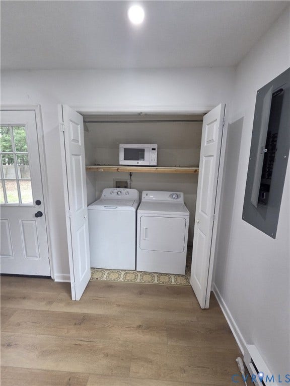 6004 Simplicity Court, Chesterfield, VA 23832 Laundry closet with built-in shelving, wood-finish flooring, and a white paneled door