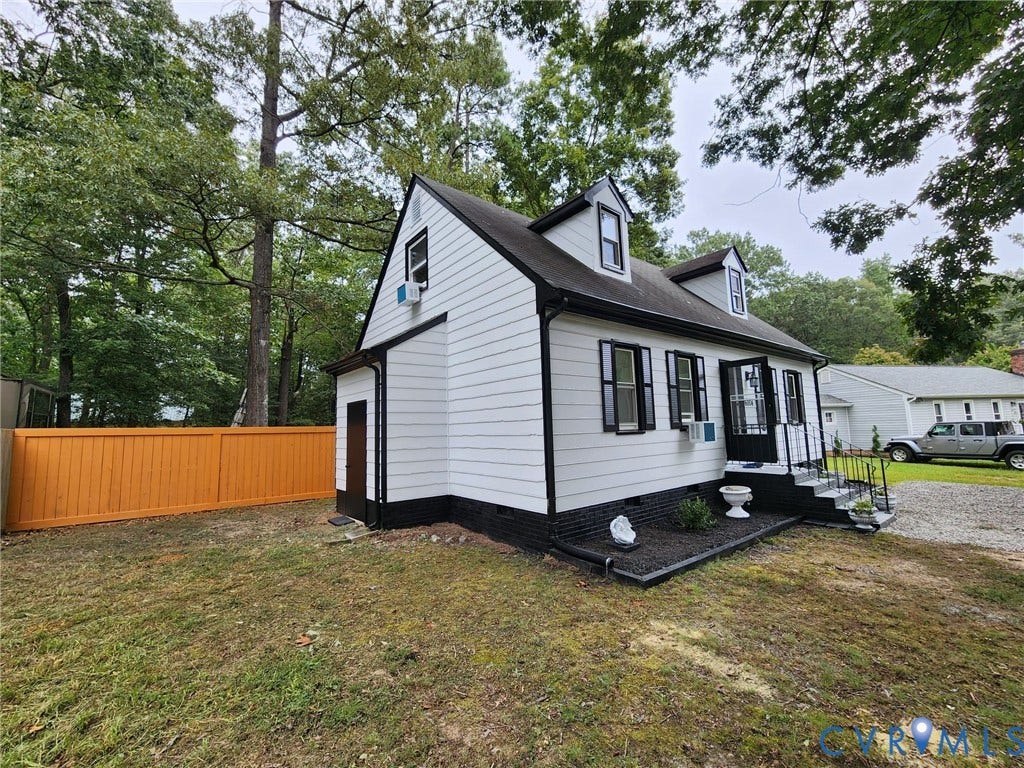 6004 Simplicity Court, Chesterfield, VA 23832 White siding exterior with black trim, black shutters, and two dormer windows