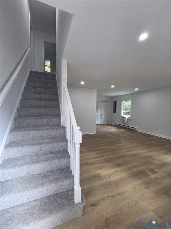 6004 Simplicity Court, Chesterfield, VA 23832 Light gray wall paint, recessed ceiling lighting, light wood-finish flooring, white painted stair railing, and gray carpeted stairs