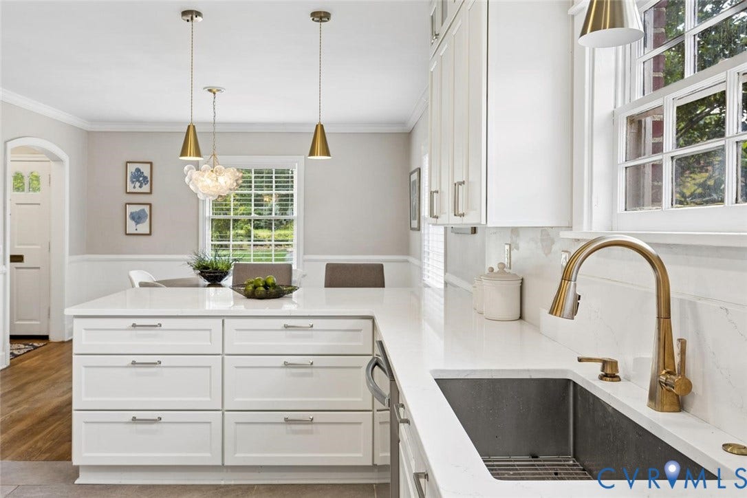 1316 Brookland Parkway, Richmond, VA 23227 White shaker cabinetry, light-toned countertops, a stainless-steel sink, and a brass-finish faucet