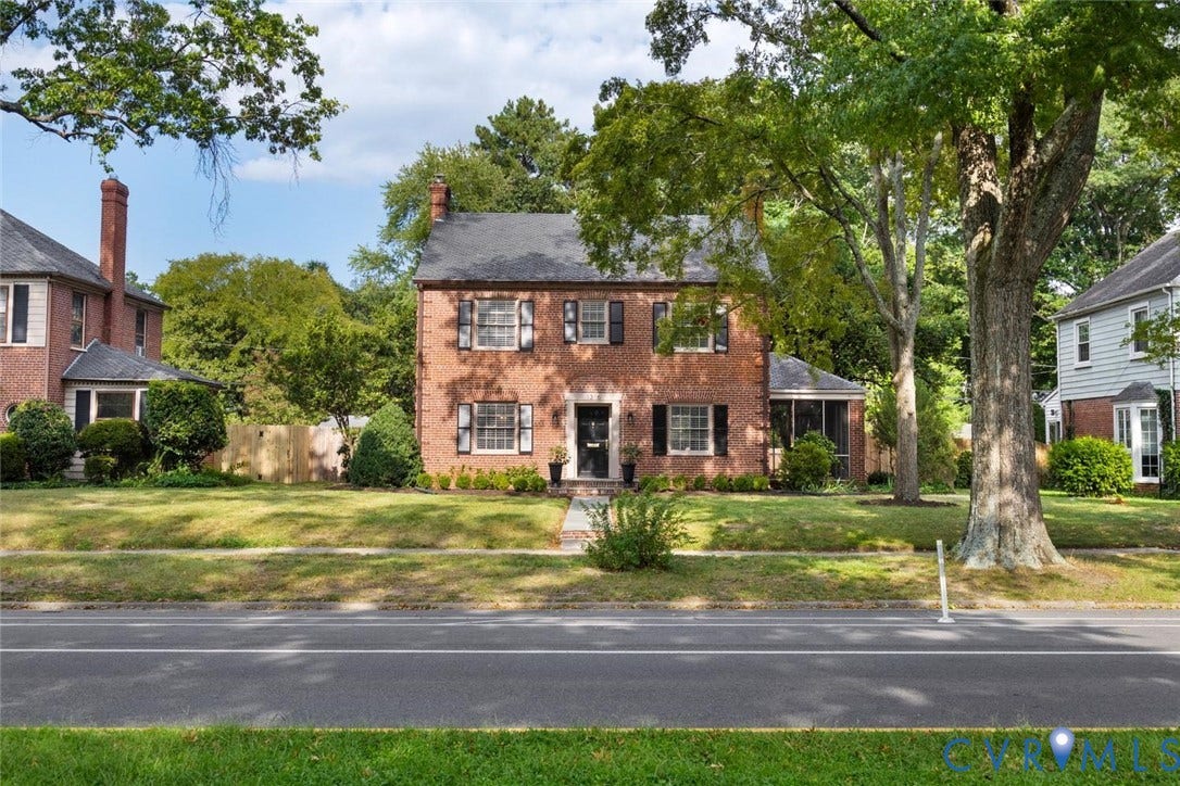 1316 Brookland Parkway, Richmond, VA 23227 Brick exterior with black shutters, mature trees, a manicured lawn, and a screened porch
