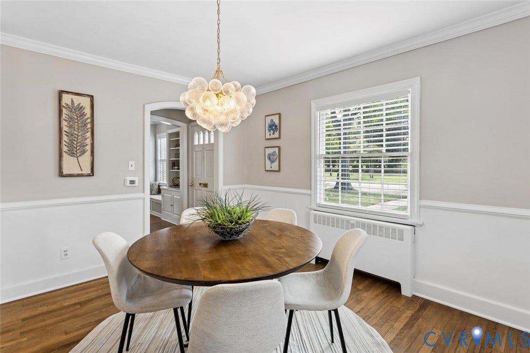 1316 Brookland Parkway, Richmond, VA 23227 Hardwood flooring, crown molding, chair rail molding, window with blinds, and decorative chandelier