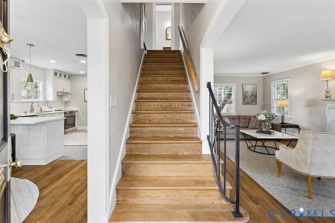 1316 Brookland Parkway, Richmond, VA 23227 Hardwood stairs with wrought iron railing, wood-finish flooring, recessed lighting, white kitchen cabinetry, and pendant lighting