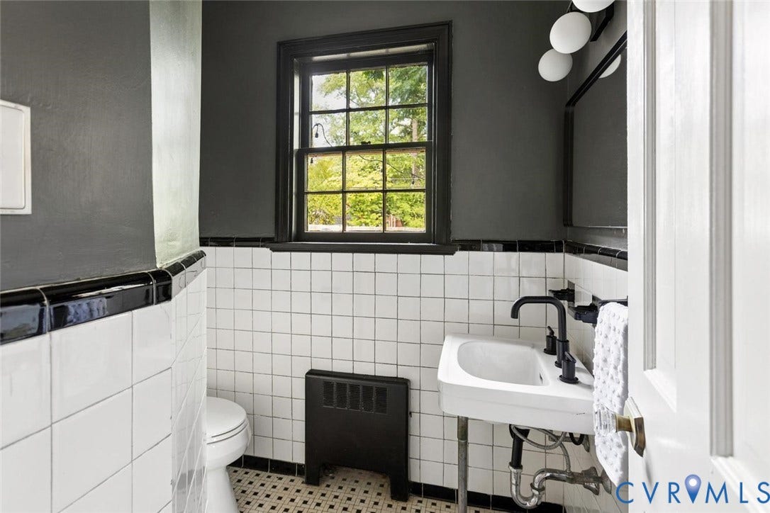 1316 Brookland Parkway, Richmond, VA 23227 Powder room featuring white subway tile, black trim, pedestal sink with matte black fixtures, and a grid-patterned window