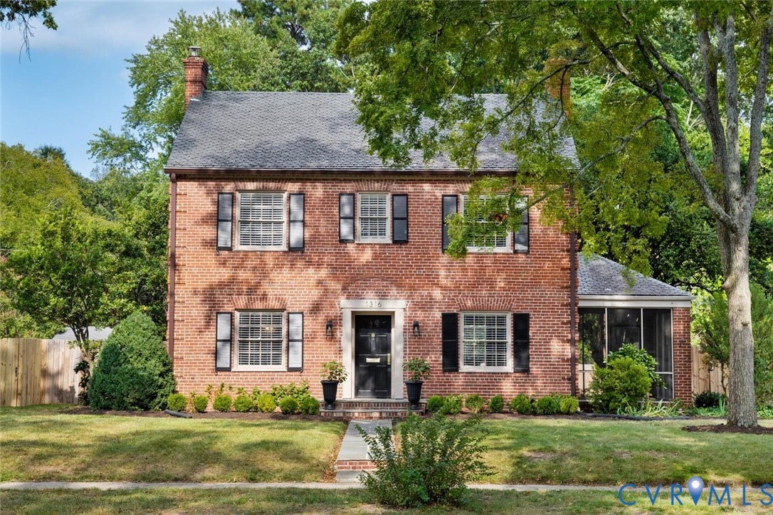 1316 Brookland Parkway, Richmond, VA 23227 Brick exterior with a gabled roof, a screened porch, well-maintained lawn, and mature trees