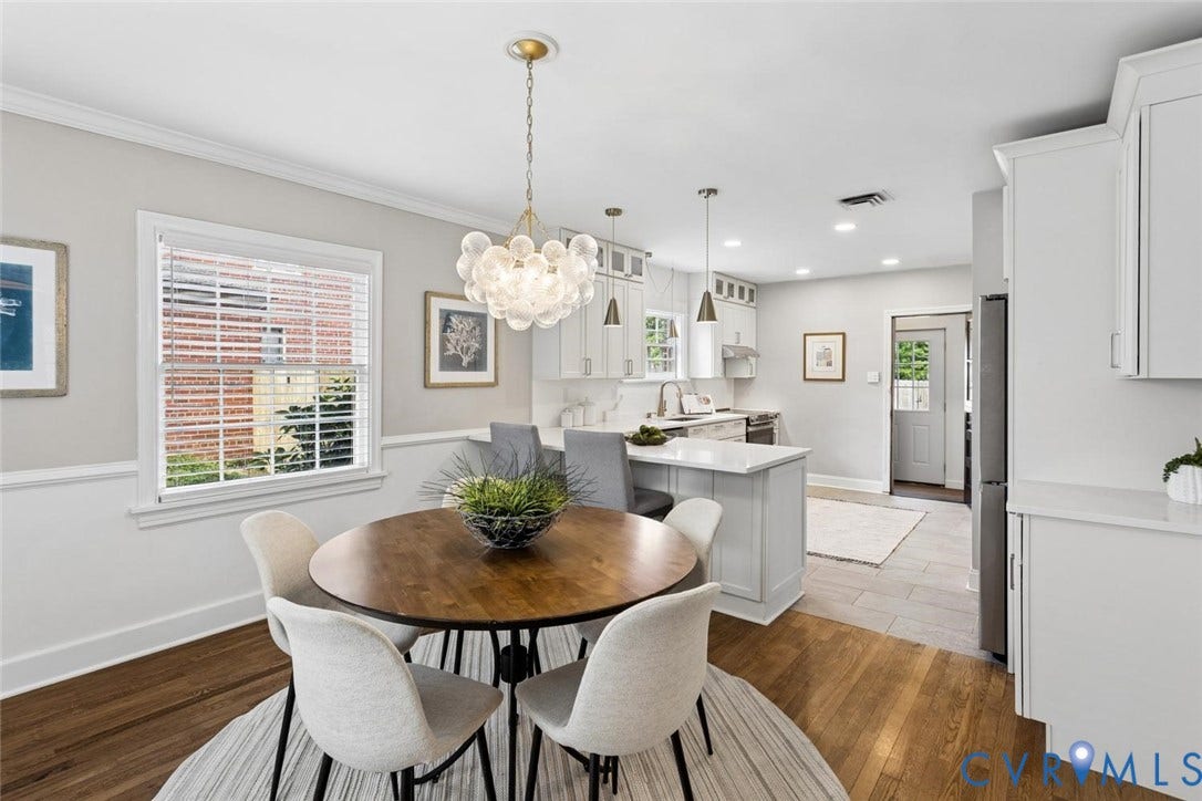 1316 Brookland Parkway, Richmond, VA 23227 Wood-finish flooring, white trim, and a contemporary chandelier