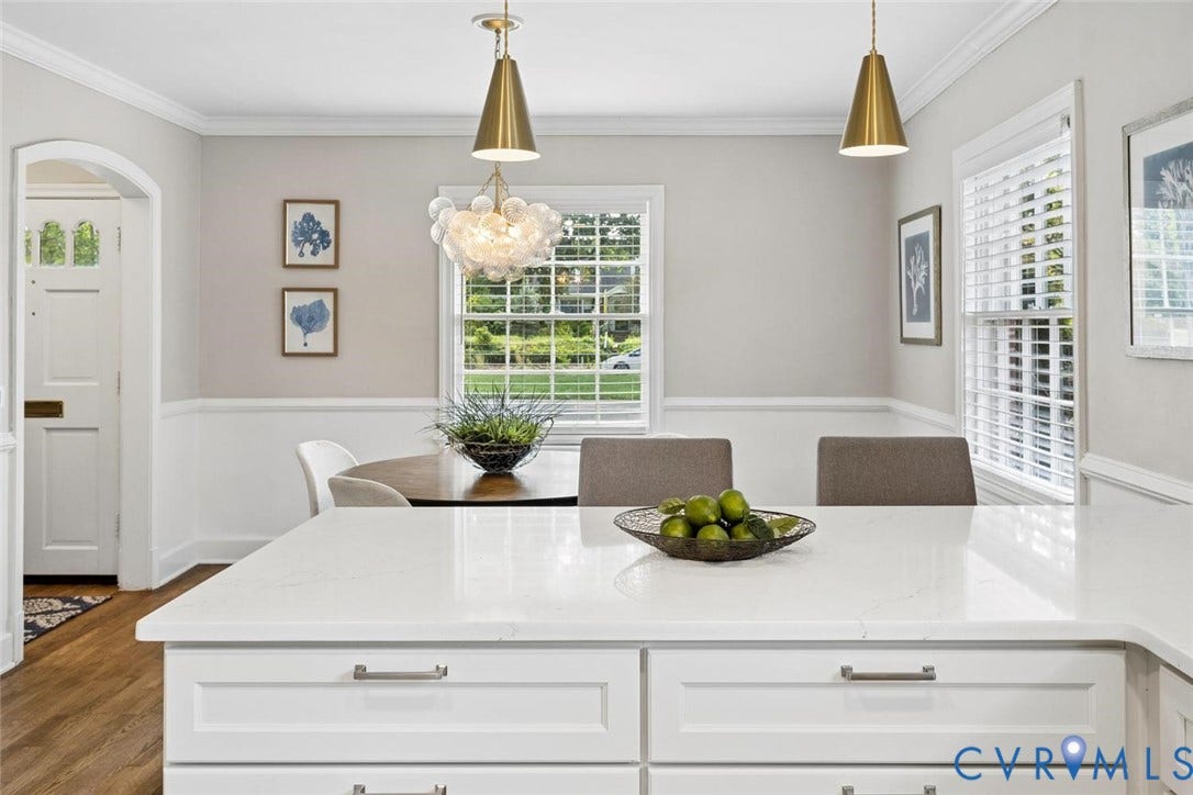 1316 Brookland Parkway, Richmond, VA 23227 White kitchen island with a light-toned countertop, wood-finish flooring, and pendant lighting fixtures