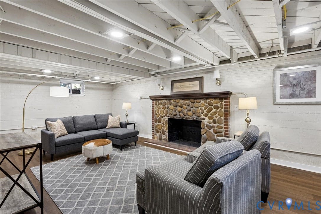 1316 Brookland Parkway, Richmond, VA 23227 Exposed ceiling joists with recessed lighting, stone and brick fireplace with wood mantel, wood-finish flooring, and white painted brick walls