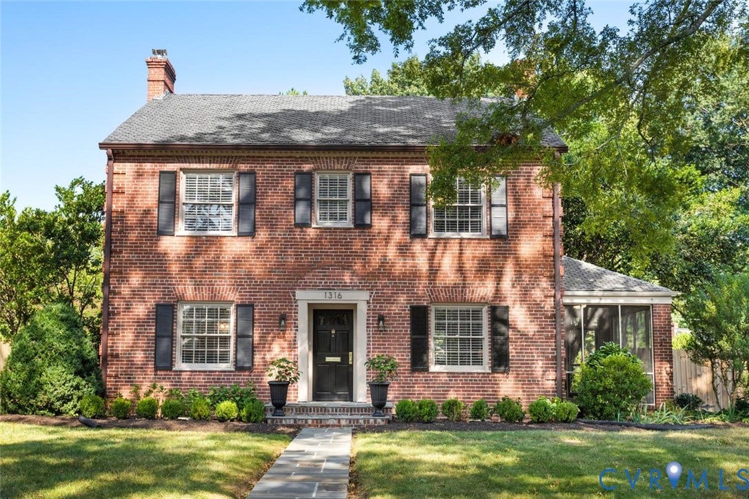 1316 Brookland Parkway, Richmond, VA 23227 Brick exterior with black shutters and white window frames