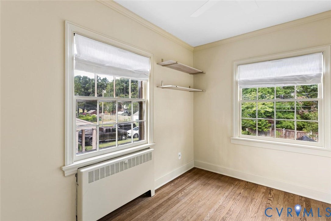 1316 Brookland Parkway, Richmond, VA 23227 Wood-finish flooring, multiple windows, built-in shelving, and crown molding